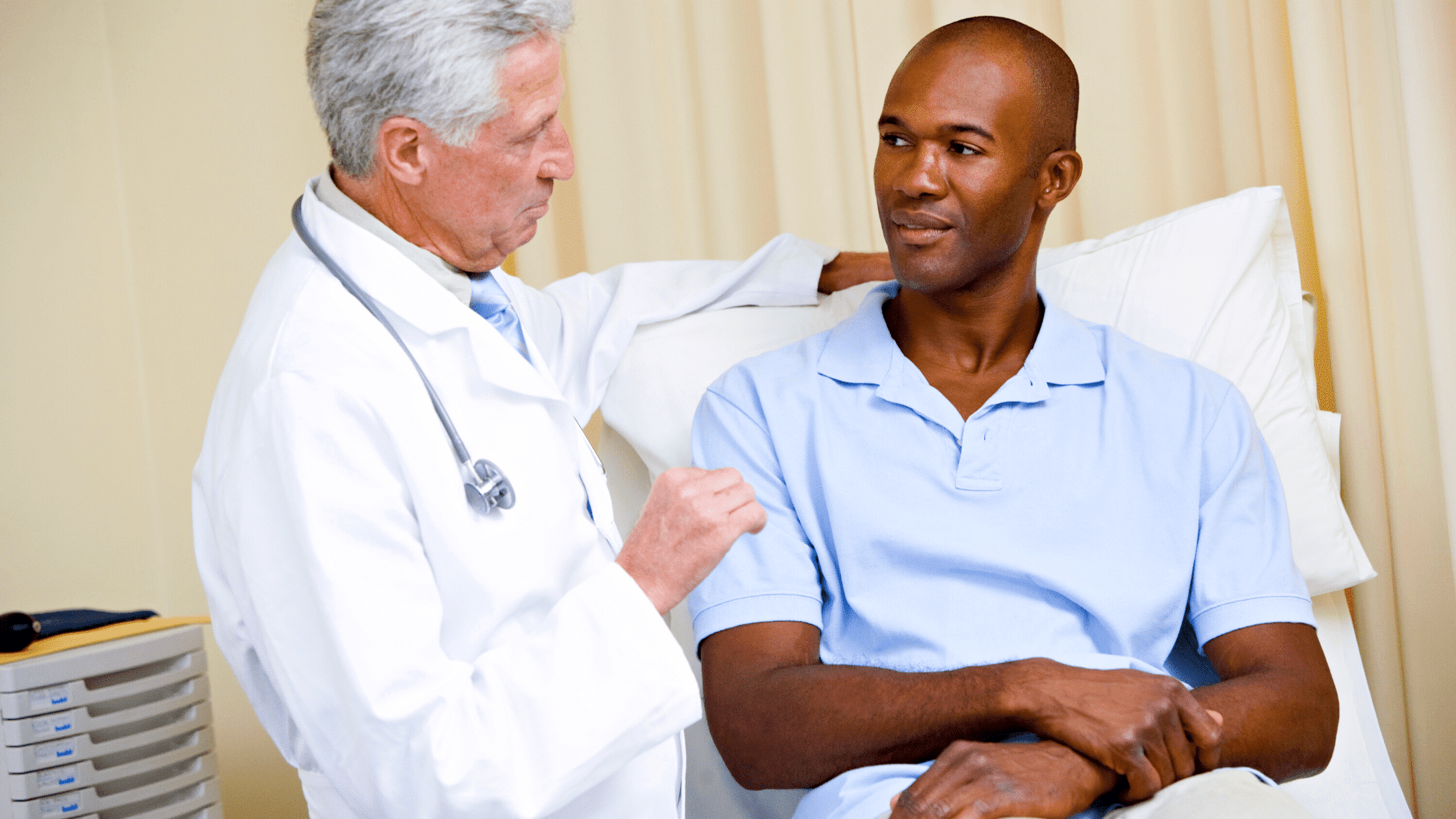 A doctor talking to a Black American man