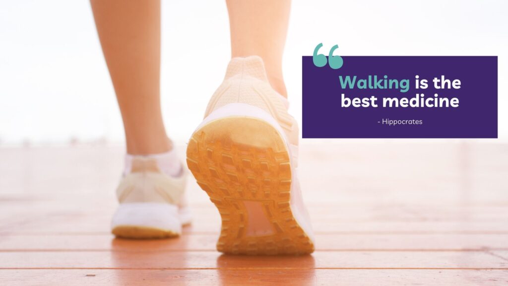 Close-up of a person's feet in sneakers walking on a wooden surface, with a quote overlay that reads, "Walking is the best medicine - Hippocrates."