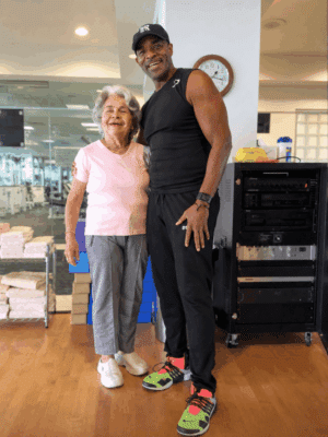 Nate O. Wilkins coaching a personal training session for Ageless Workout Tribe member