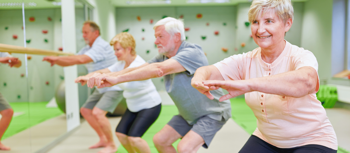 Older adults squatting, smiling confidently; symbolizing healthy aging and bone strength